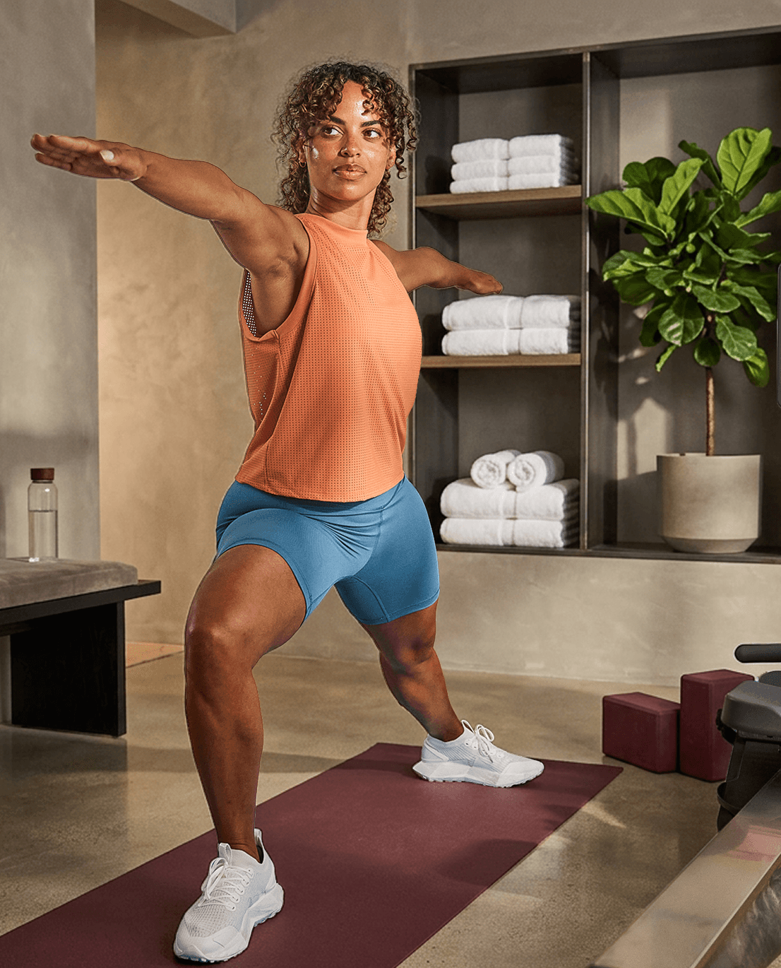 A person doing a lunge on a mat during a cross-training workout at home